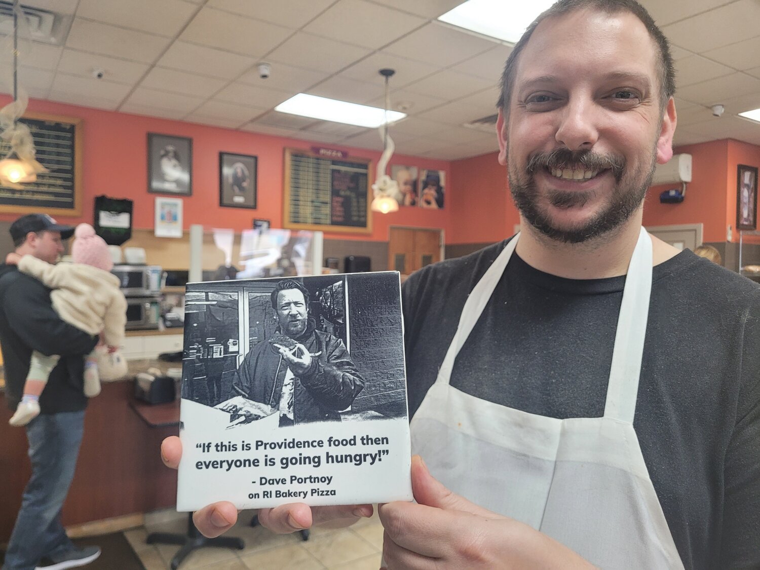 TILE TRIGGERS A SMILE: A friend of Eric Palmieri, of D. Palmieri’s Bakery in Johnston, immortalized a quote from Dave Portnoy’s visit on a ceramic tile, which will now be kept in a place of honor.